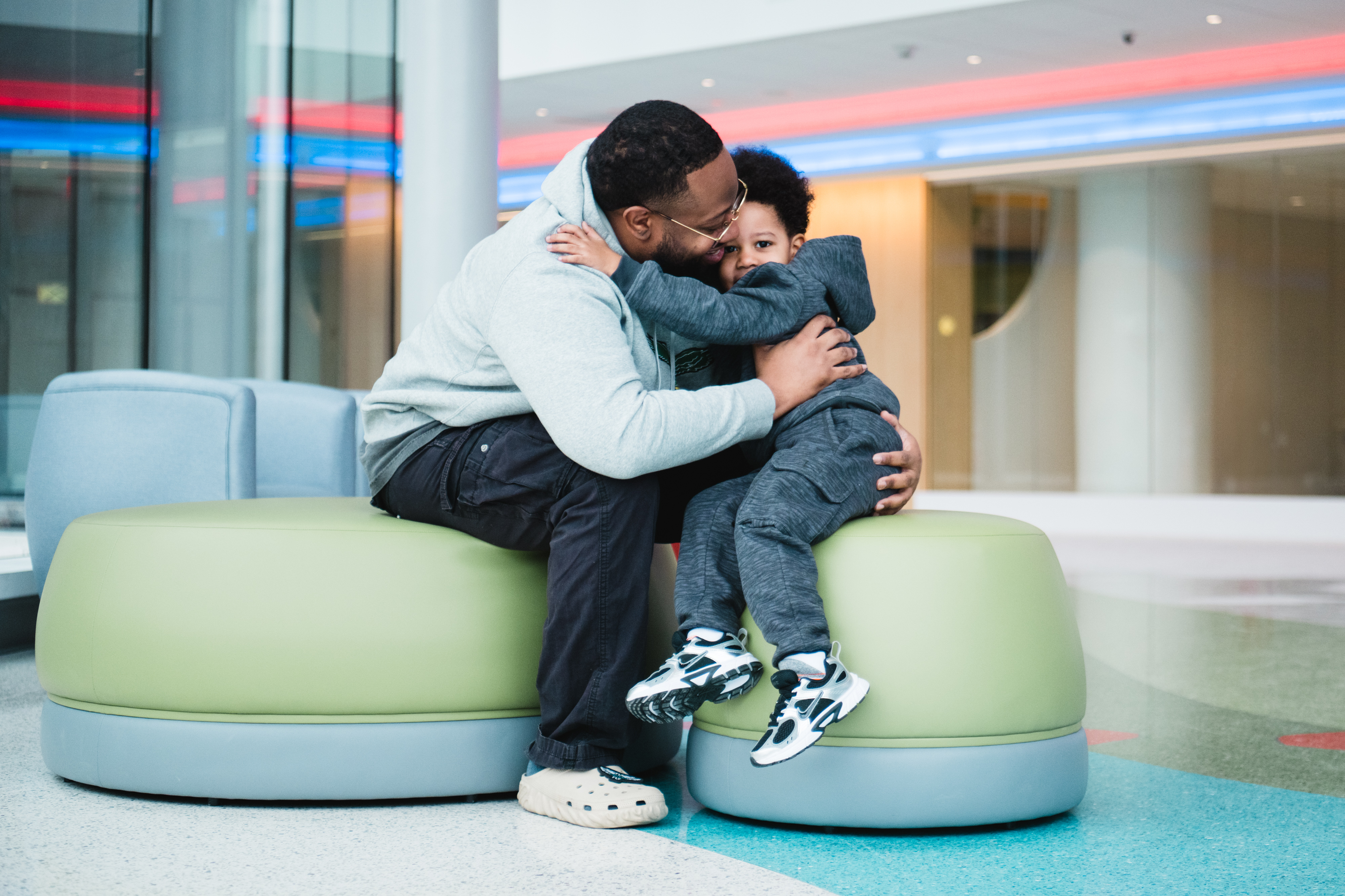 A father and son hugging in the new tower