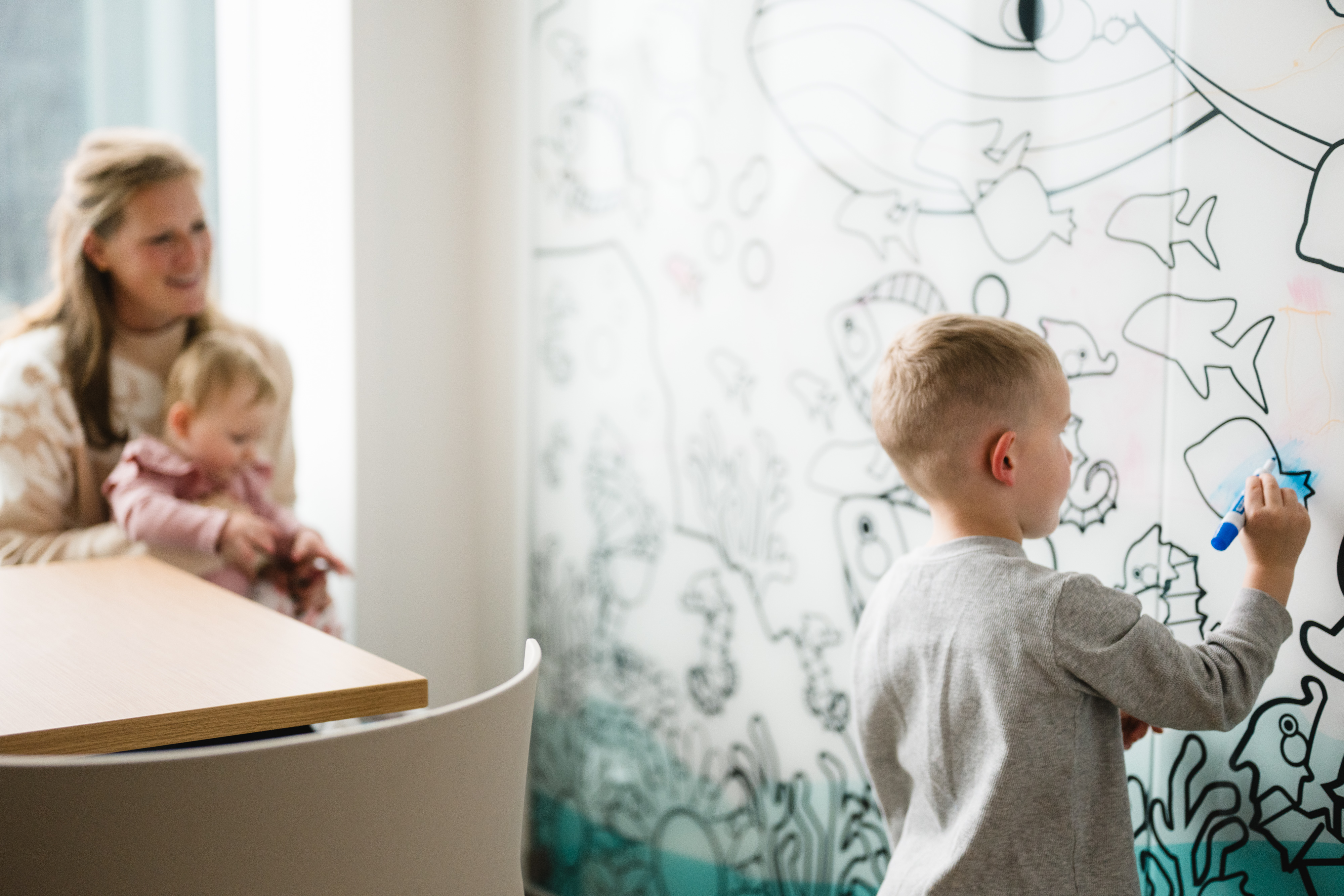 young child coloring on the new walls at the new tower