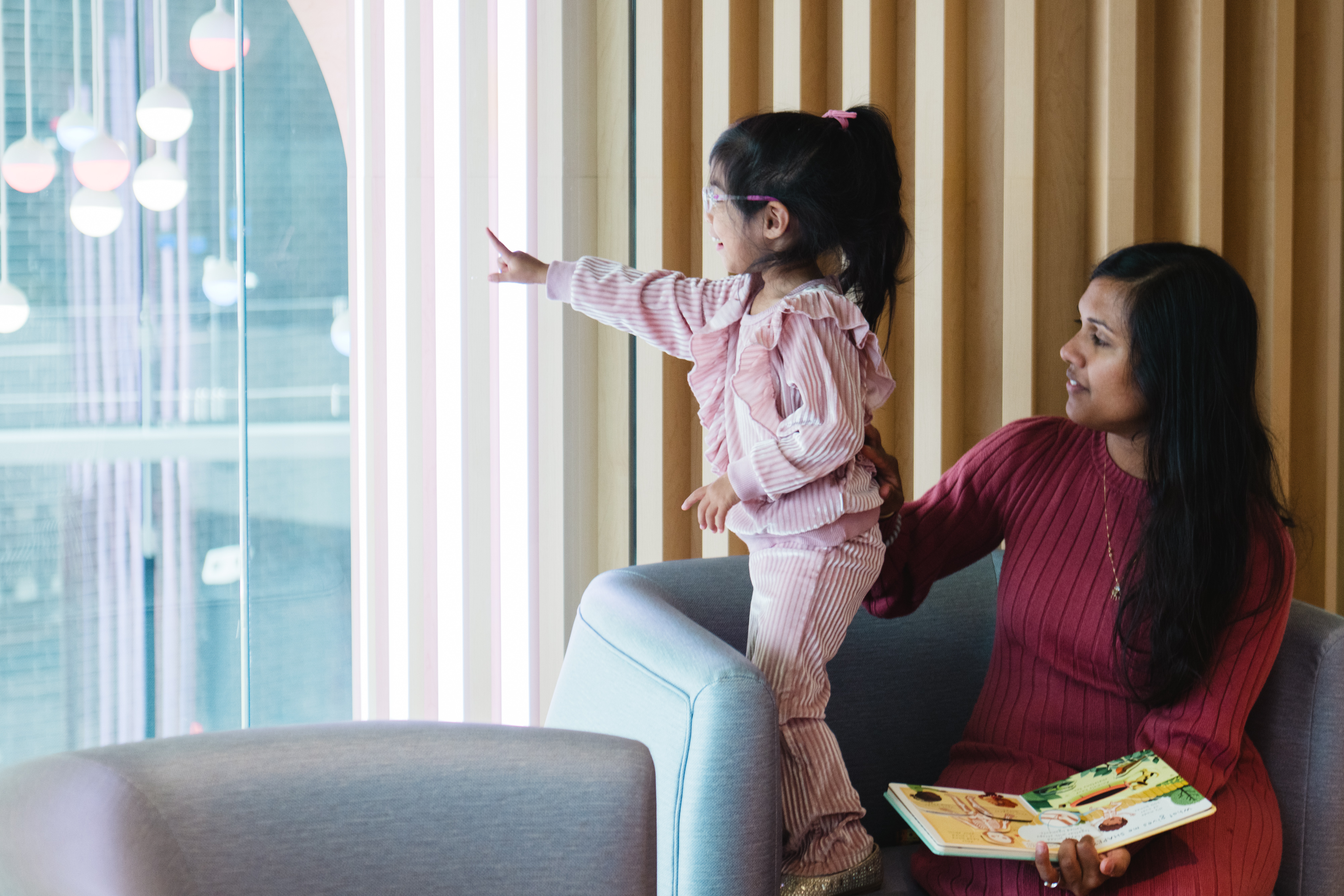 A child and mother interacting in the tower