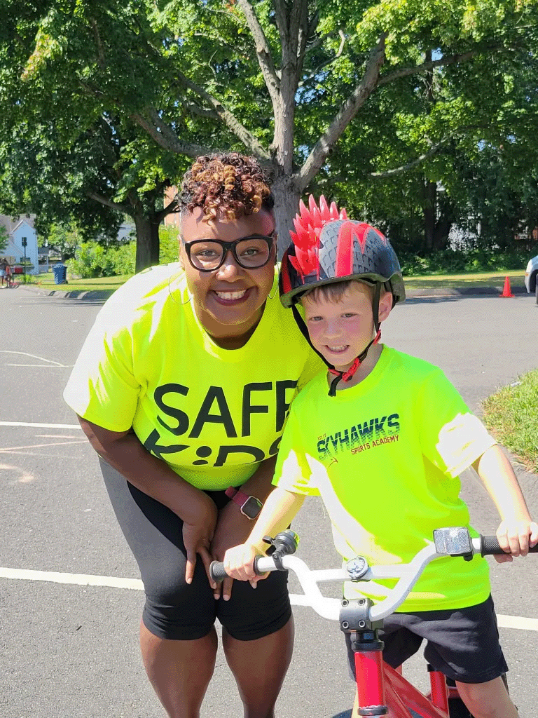 Biked bike helmet posing with staff member