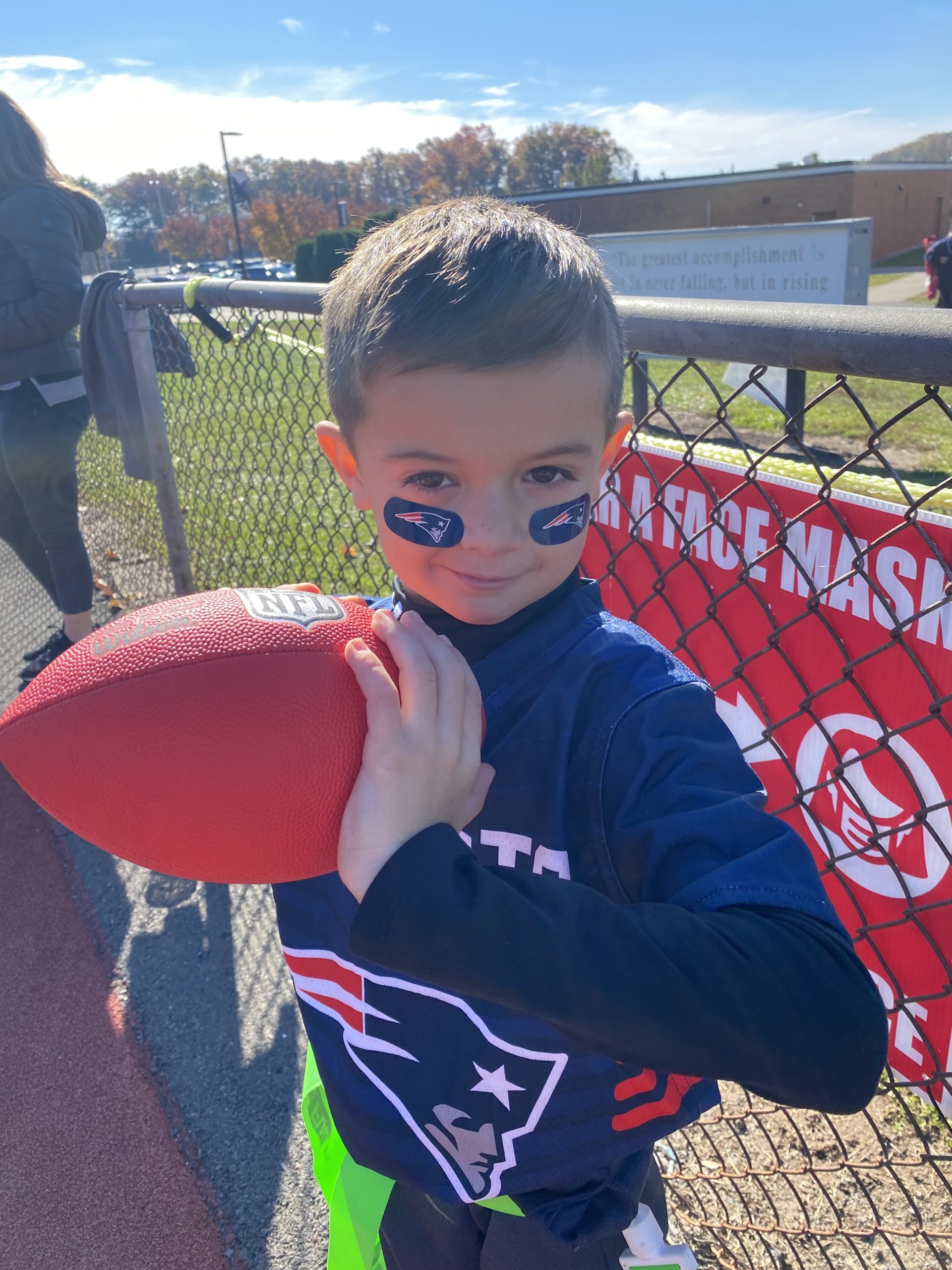 Tyler holding a football