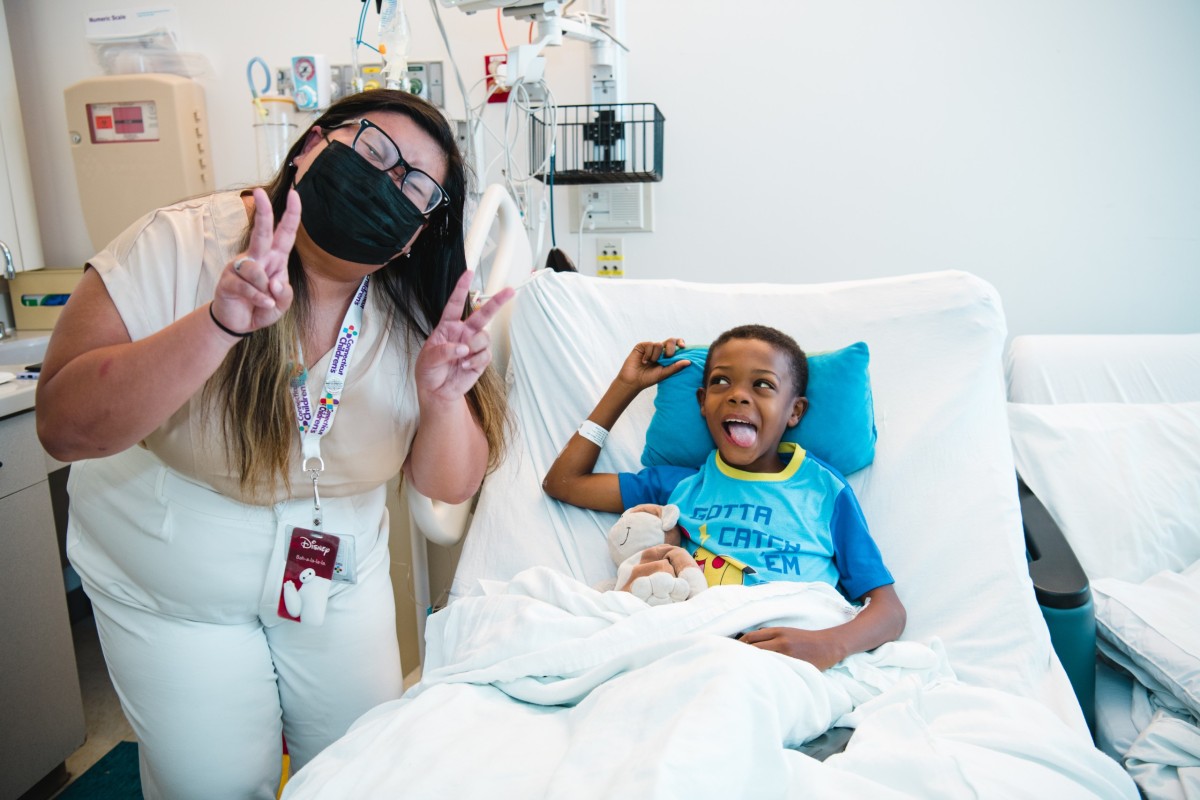 Kelly Ha, founder of the “I See Me” program, poses with a young champion