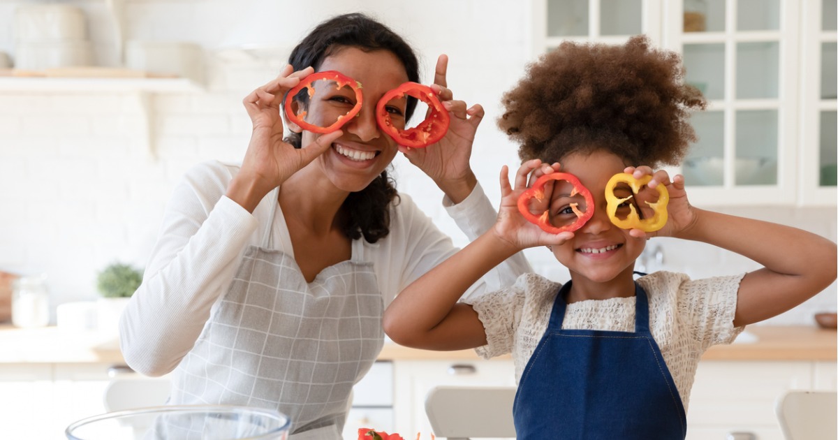 A mother and her daughter cook