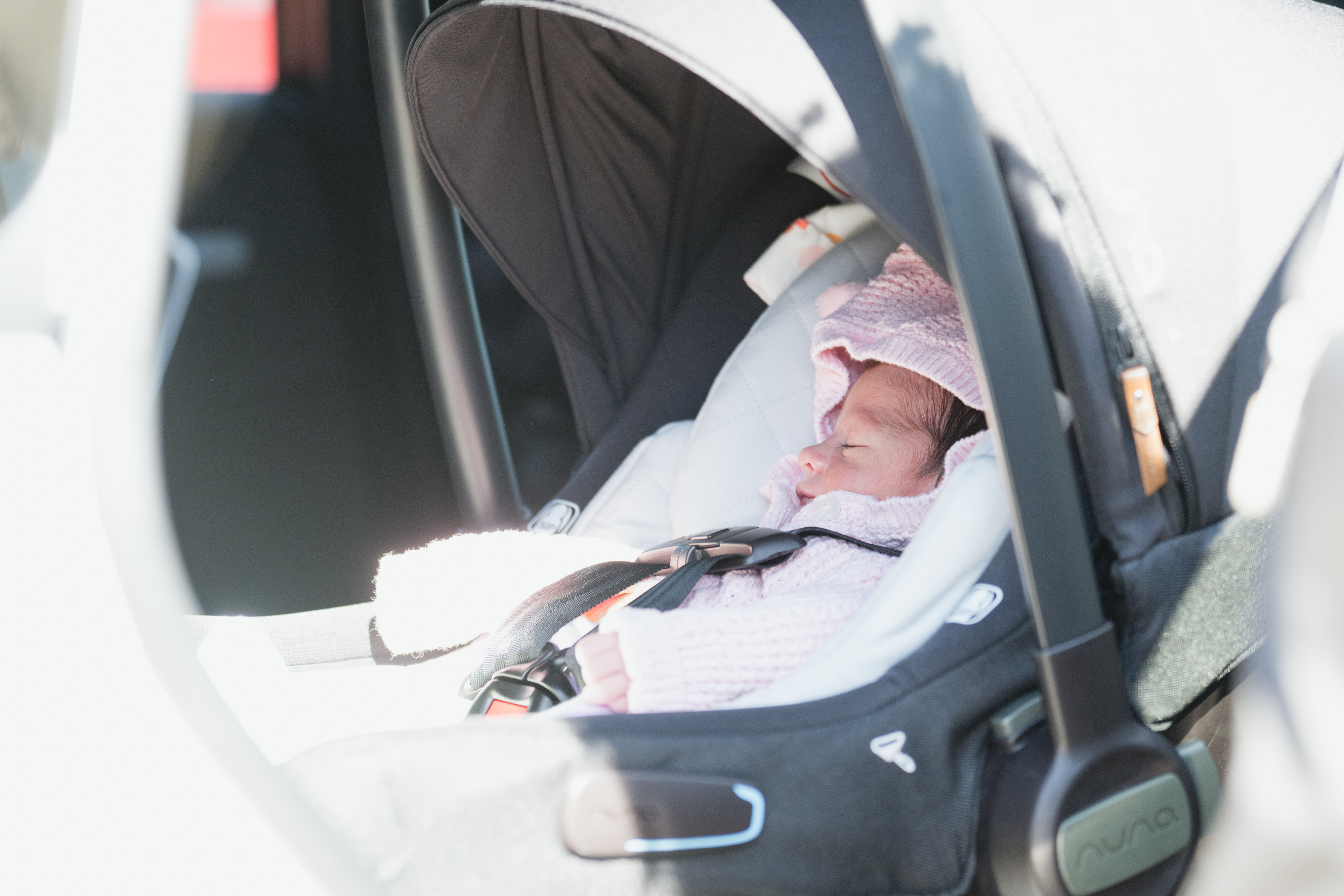 A child in their car seat