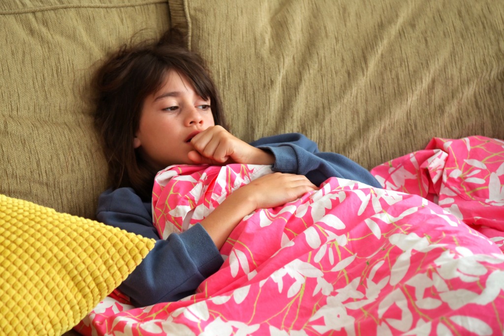 young sick girl coughing on couch. is it mycoplasma pneumonia?