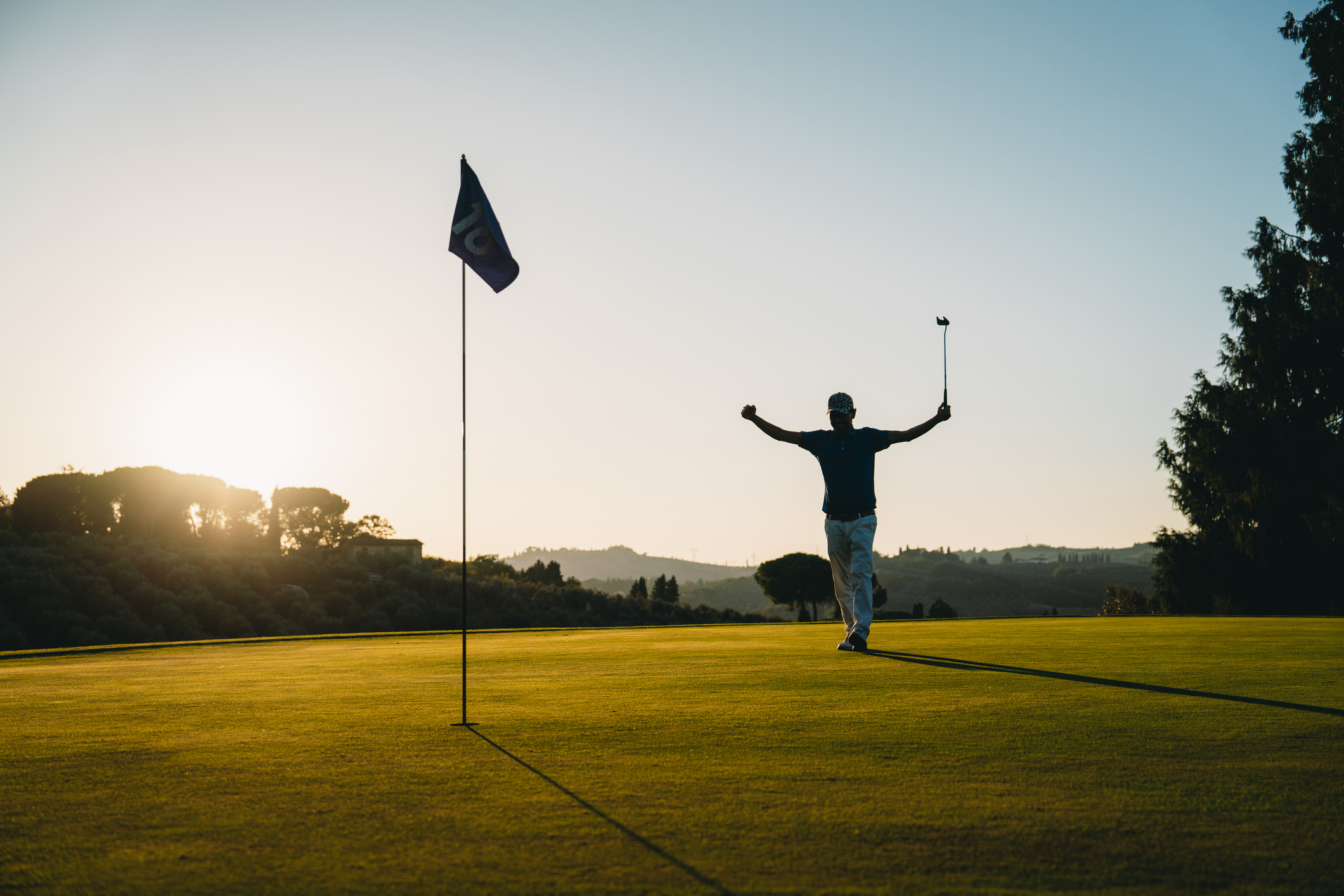 Person celebrating on a golf course