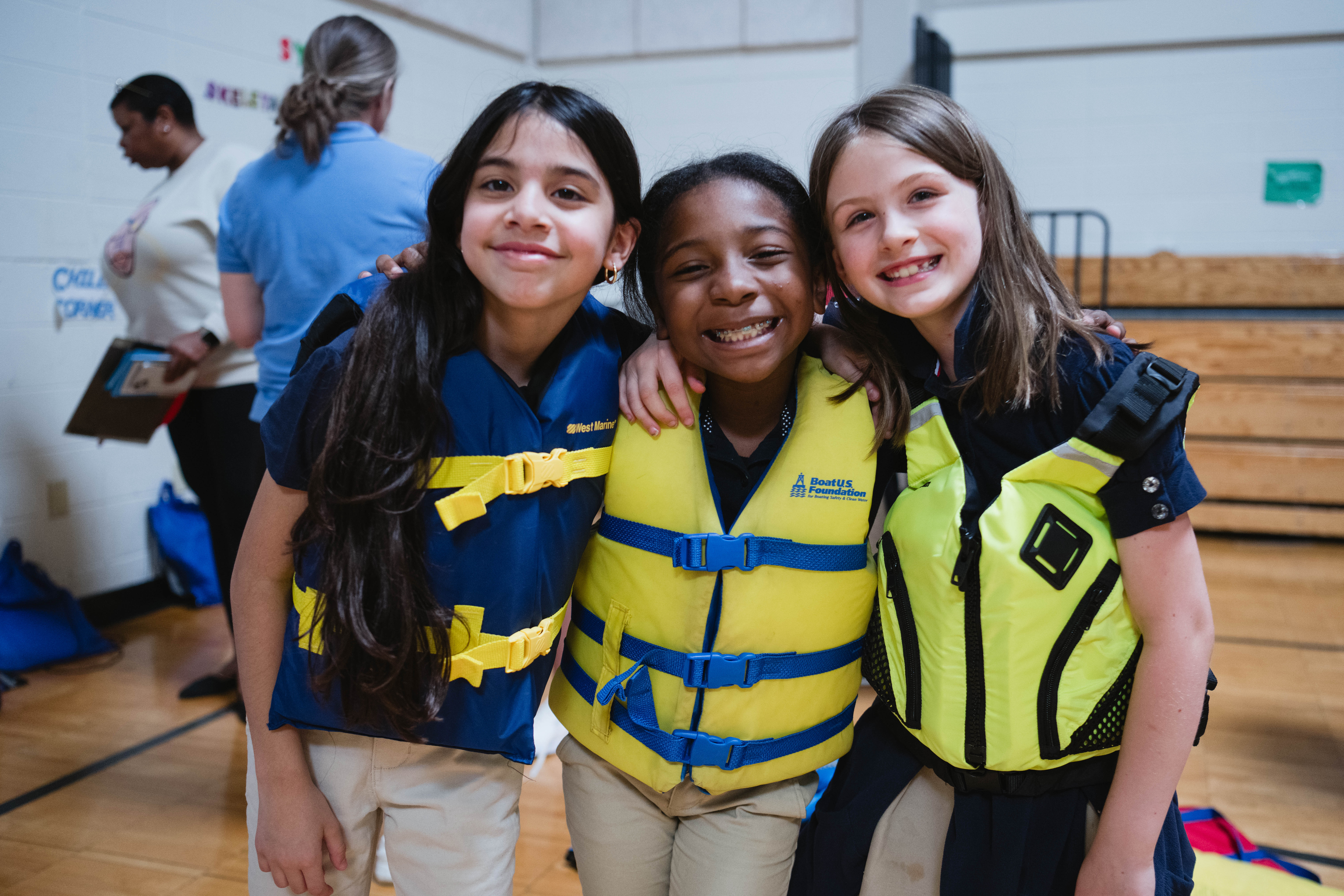 Children in life jackets at a Safe Kids event