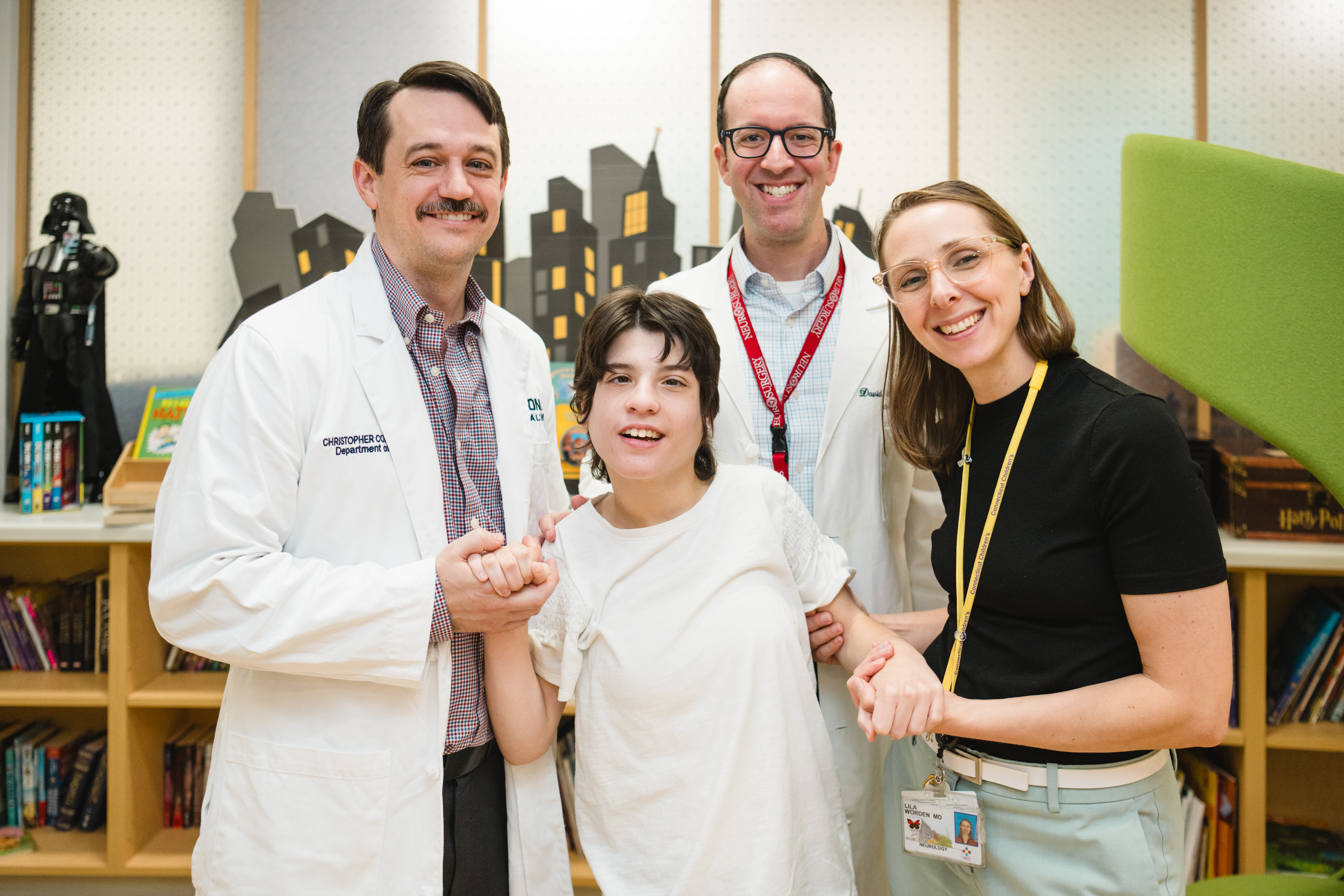 Deep brain stimulation patient with her doctors in the Family Resource Center