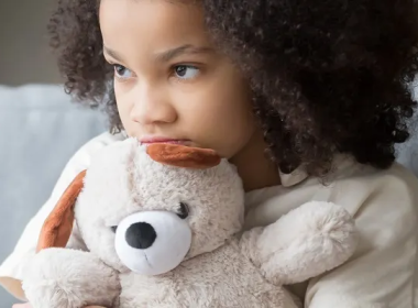 Girl holding a teddy bear 