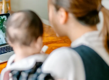 Mom and child looking at a computer screen