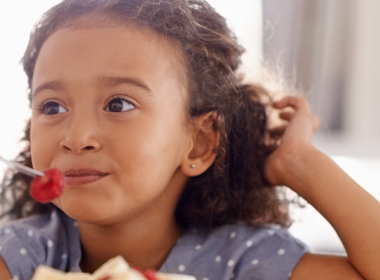 Girl eating fruit