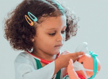 Girl playing with a doll