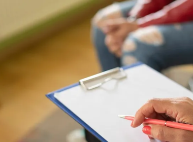 Counselor holding a clipboard