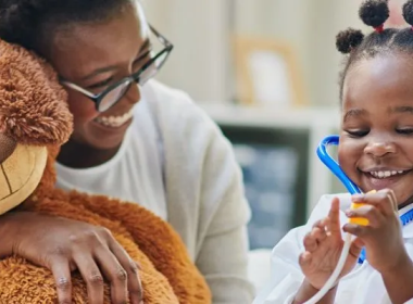 Girl wearing a stethoscope.