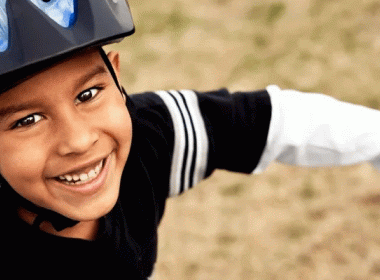 Boy wearing a bike helmet