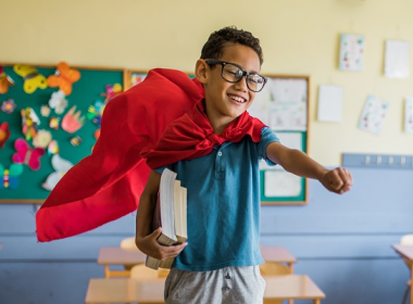 Boy wearing a cape