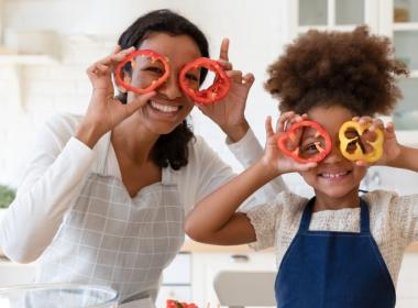 A mother and her daughter cook