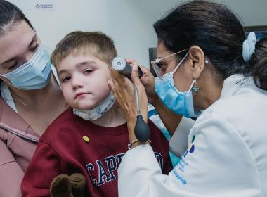 Young boy getting his ears examined