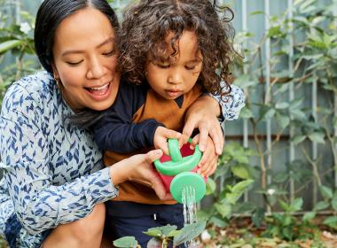 Mother and her child gardening