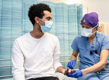 A male teen at the doctor