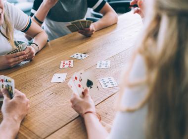 Teens playing cards