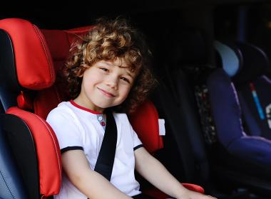 Young boy in his car seat