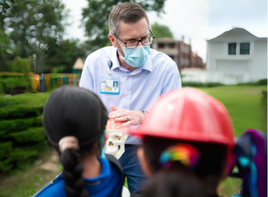 doctor giving talk at school