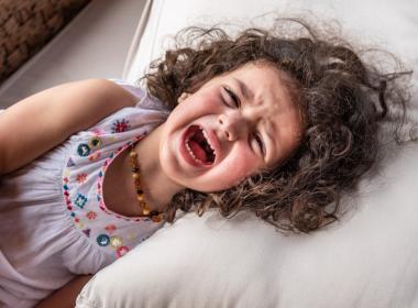 Child screaming in bed