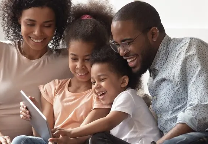 Family looking at a tablet