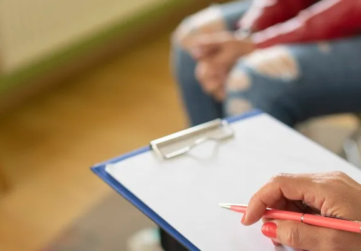 Counselor holding a clipboard