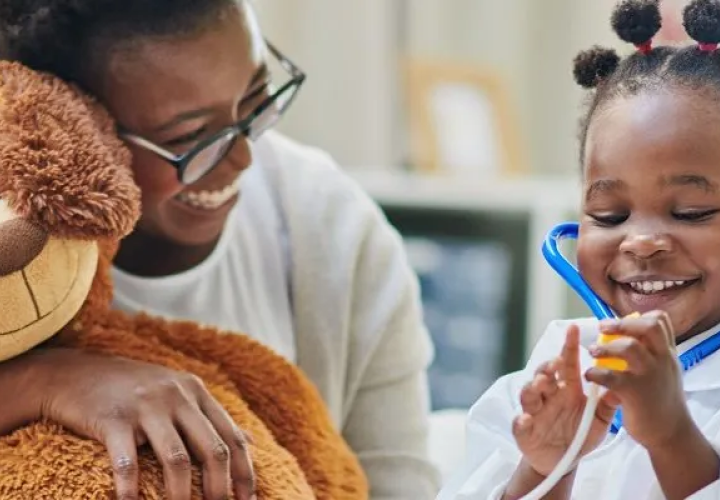 Girl wearing a stethoscope.