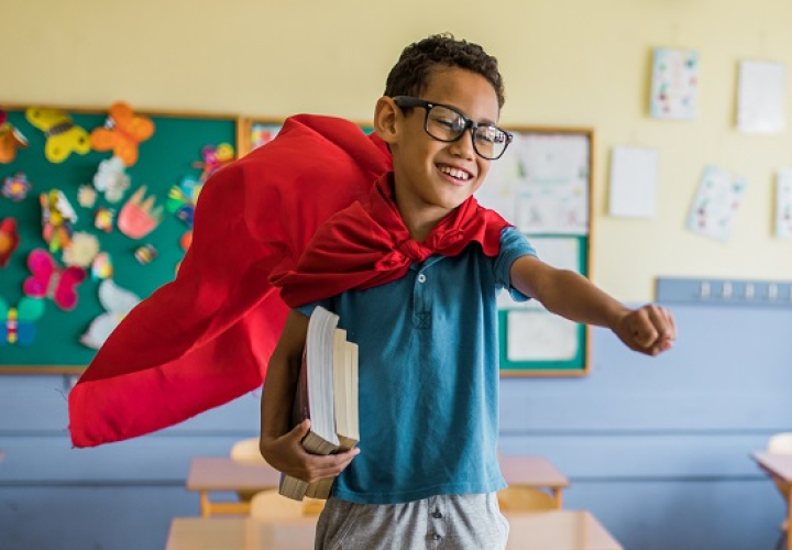 Boy wearing a cape