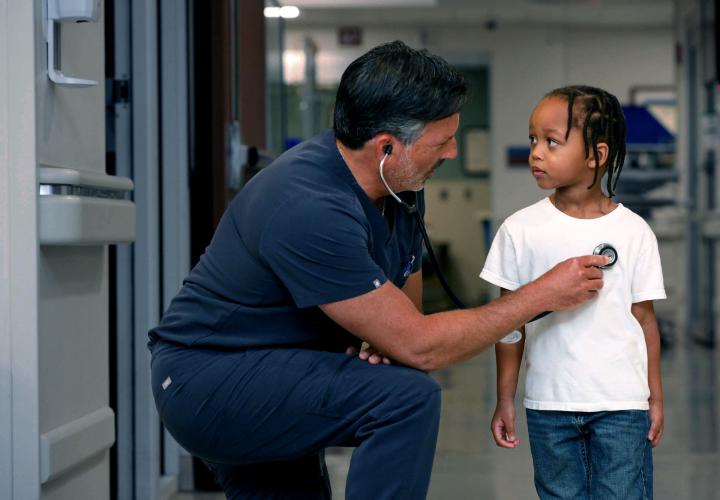 An emergency medicine physician examines a patient in the Norwalk Hospital pediatric emergency department.