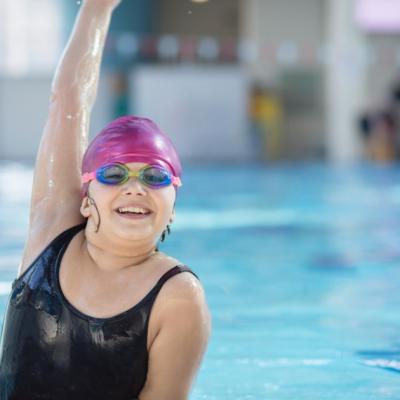 Young girl poses in the pool