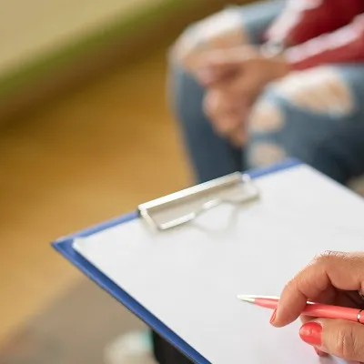 Counselor holding a clipboard