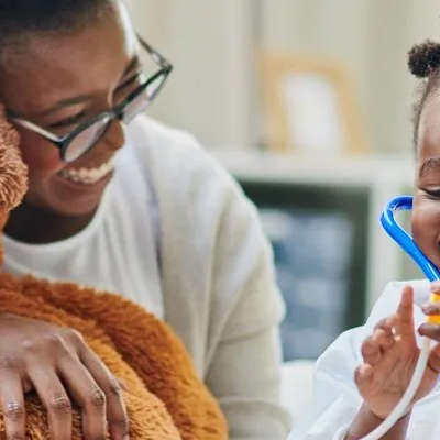 Girl wearing a stethoscope.