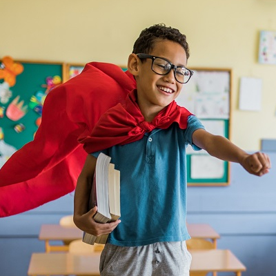 Boy wearing a cape