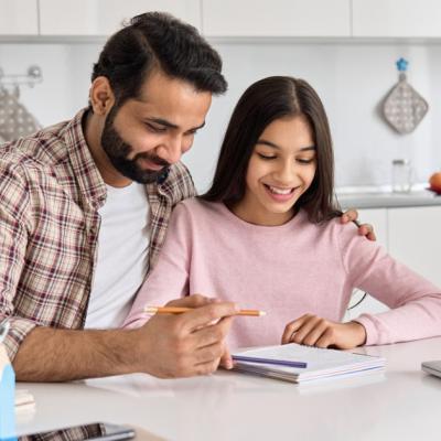 A father helping his daughter with homework