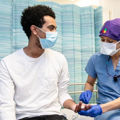 A male teen at the doctor