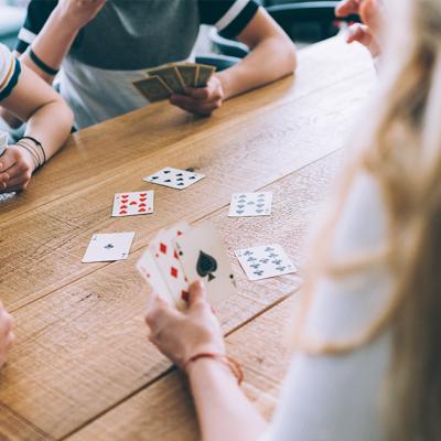 Teens playing cards