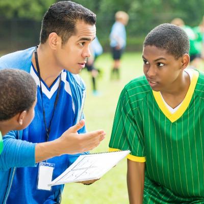 Coach talks to his players