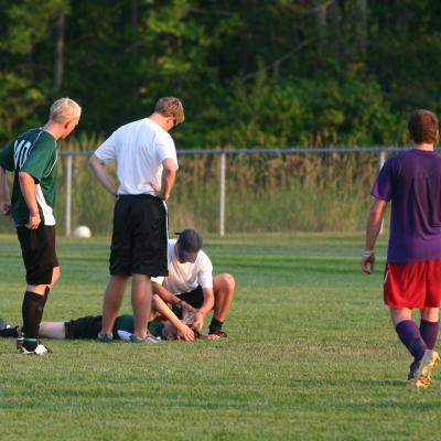 Soccer player down on field with injury