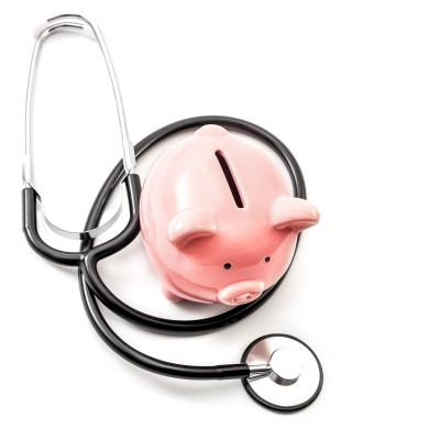 Piggy bank and a stethoscope. 