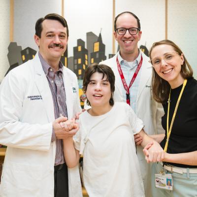 Deep brain stimulation patient with her doctors in the Family Resource Center